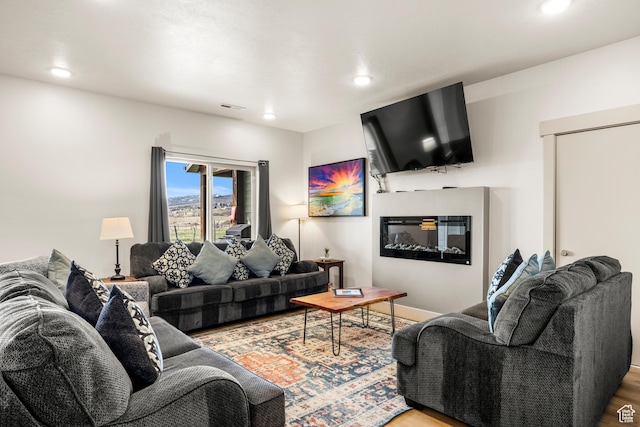 140 W 150 S Unit H29, Garden City, UT 84028 - living room with wood finished floors, visible vents, and recessed lighting