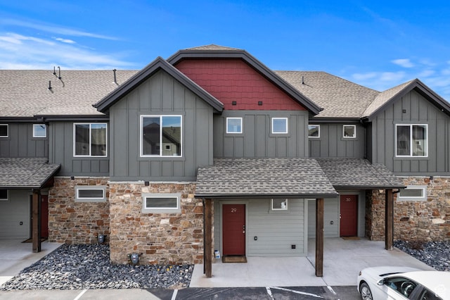 140 W 150 S Unit H29, Garden City, UT 84028 - view of front of home featuring board and batten siding, a shingled roof, and stone siding