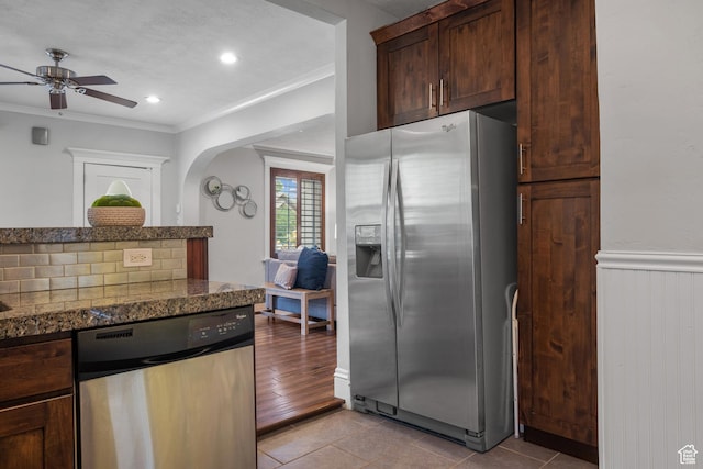 447 E Westminster Ave S, Salt Lake City, UT 84115 - kitchen with stainless steel appliances, crown molding, a ceiling fan, light tile patterned floors, and dark brown cabinetry