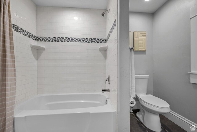 447 E Westminster Ave S, Salt Lake City, UT 84115 - full bathroom with tile patterned flooring, baseboards, shower / bath combination with curtain, and toilet