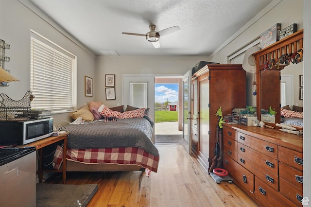 2490 S State St, Springville, UT 84663 - bedroom with light wood-type flooring, access to outside, crown molding, and ceiling fan