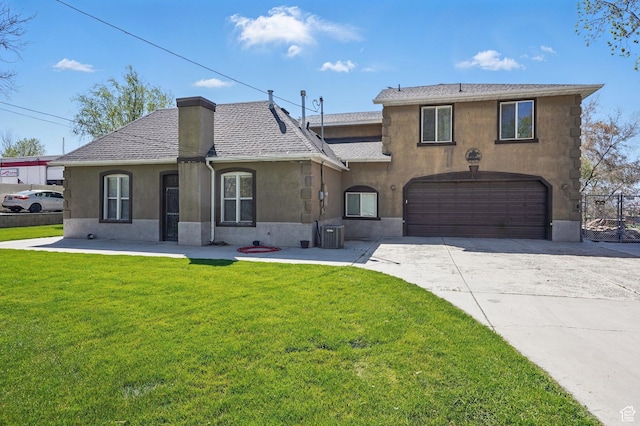 2490 S State St, Springville, UT 84663 - view of front of home featuring driveway, cooling unit, stucco siding, a front lawn, and a garage