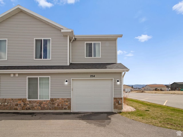 254 W Seasons Ln, Garden City, UT 84028 - view of home's exterior with stone siding and a garage