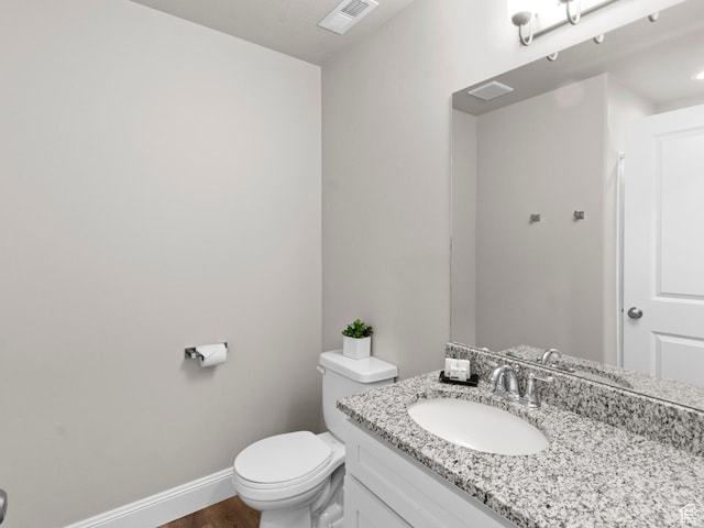 254 W Seasons Ln, Garden City, UT 84028 - half bath featuring visible vents, baseboards, toilet, wood finished floors, and vanity