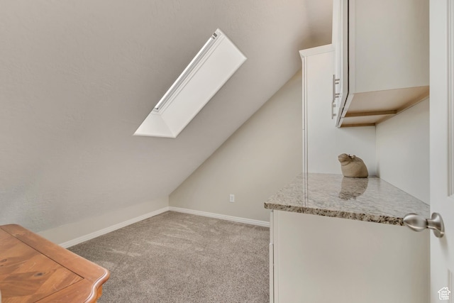 4352 W Degray Dr S, South Jordan, UT 84009 - bonus room featuring baseboards, vaulted ceiling with skylight, and carpet flooring