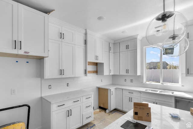 1232 W 575 S, Logan, UT 84321 - kitchen with white cabinetry, decorative light fixtures, decorative backsplash, and light stone counters