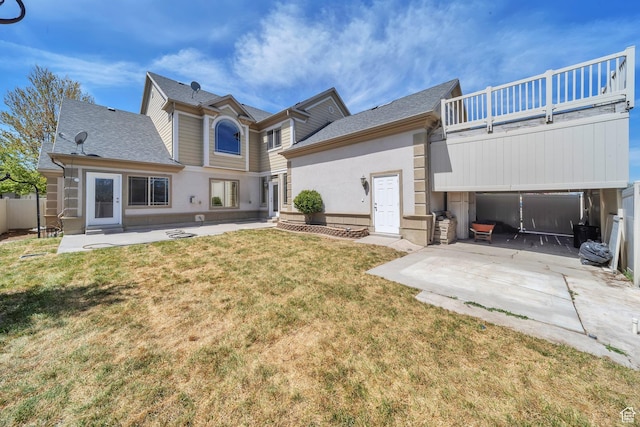 6861 S Triumph Ln, West Jordan, UT 84084 - rear view of house with a patio area, a yard, roof with shingles, and a balcony