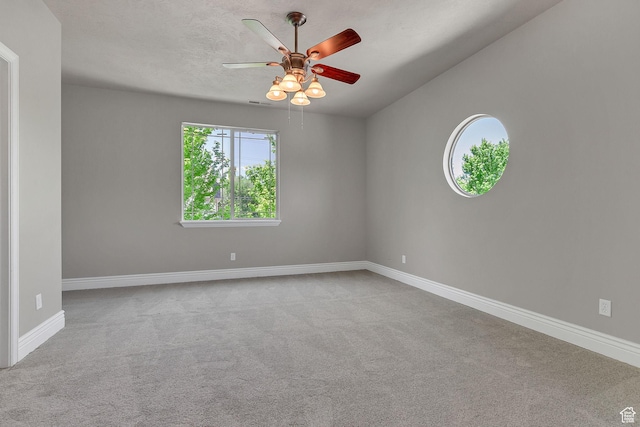 6861 S Triumph Ln, West Jordan, UT 84084 - carpeted spare room with ceiling fan and baseboards