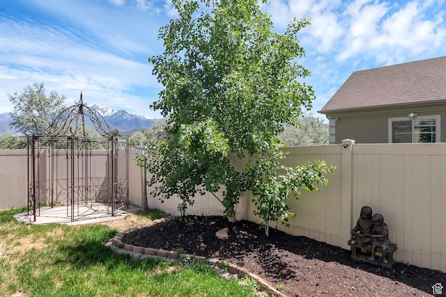 6861 S Triumph Ln, West Jordan, UT 84084 - fenced backyard with a mountain view