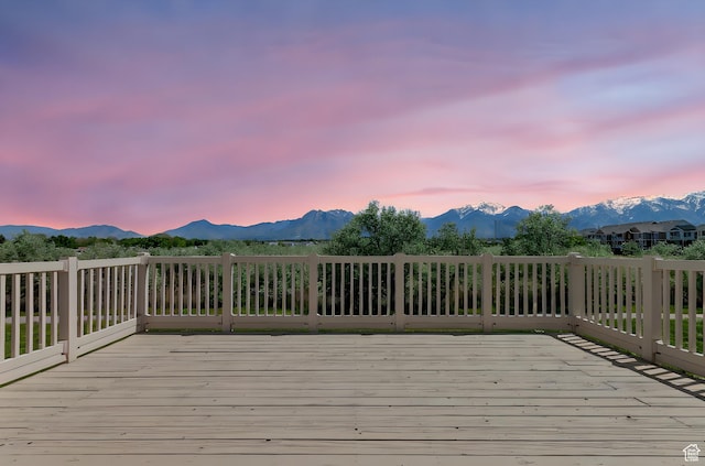6861 S Triumph Ln, West Jordan, UT 84084 - deck at dusk with a mountain view