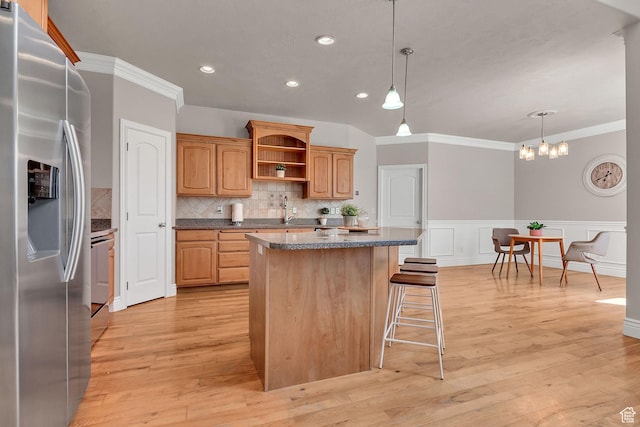 6861 S Triumph Ln, West Jordan, UT 84084 - kitchen with stainless steel refrigerator with ice dispenser, a kitchen island, open shelves, crown molding, and a kitchen bar
