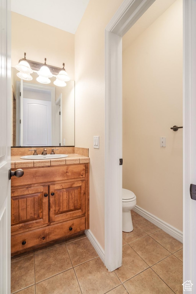 1059 S Ridge Rd, Cedar City, UT 84720 - bathroom featuring tile patterned floors, vanity, toilet, and baseboards