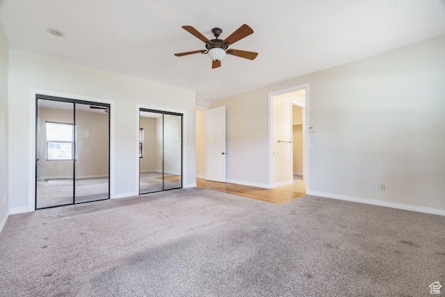 1059 S Ridge Rd, Cedar City, UT 84720 - unfurnished bedroom featuring a ceiling fan, two closets, carpet, and baseboards