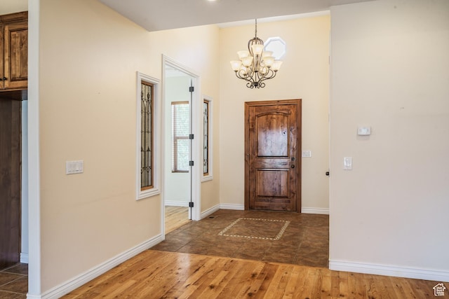 1059 S Ridge Rd, Cedar City, UT 84720 - entryway with baseboards, wood finished floors, and an inviting chandelier