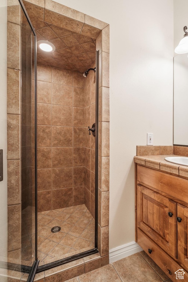 1059 S Ridge Rd, Cedar City, UT 84720 - full bath featuring baseboards, a shower stall, tile patterned flooring, and vanity