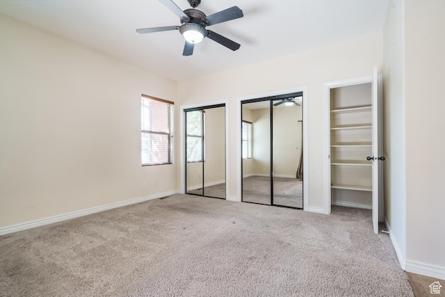 1059 S Ridge Rd, Cedar City, UT 84720 - unfurnished bedroom featuring multiple closets, carpet flooring, and multiple windows