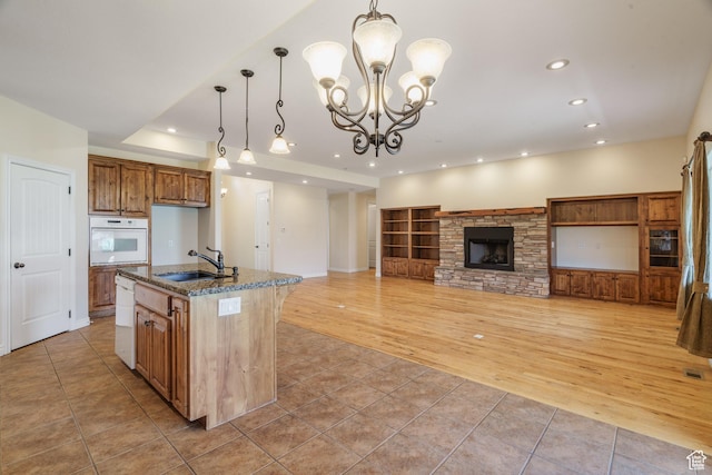 1059 S Ridge Rd, Cedar City, UT 84720 - kitchen featuring light tile patterned floors, recessed lighting, a sink, and white appliances