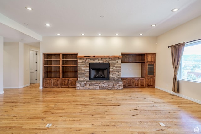 1059 S Ridge Rd, Cedar City, UT 84720 - unfurnished living room featuring a fireplace, recessed lighting, light wood finished floors, and baseboards