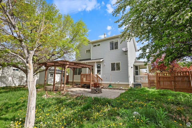 799 Country Club Dr, Stansbury Park, UT 84074 - rear view of house with a pergola, a patio area, an outdoor structure, a storage shed, and fence