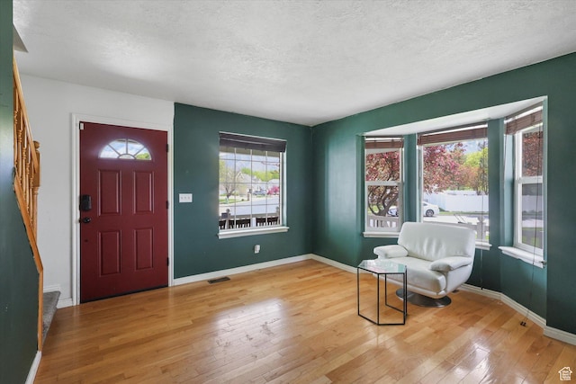 799 Country Club Dr, Stansbury Park, UT 84074 - entryway with a textured ceiling, visible vents, hardwood / wood-style floors, and stairs