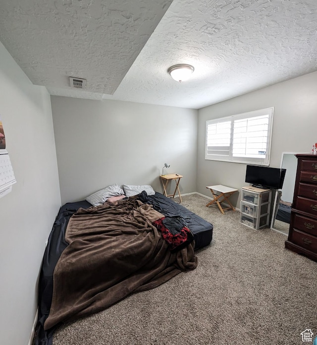 4635 W Eskesen Dr S, West Valley City, UT 84120 - carpeted bedroom featuring a textured ceiling, visible vents, and baseboards