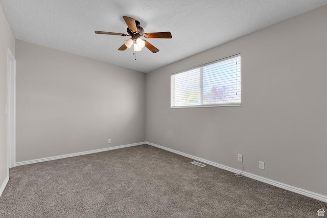 unfurnished room featuring ceiling fan, carpet floors, and baseboards