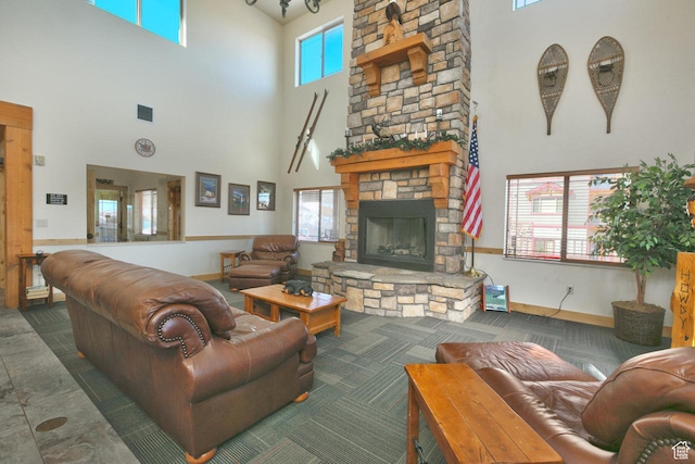 5519 N Lillehammer Ln Unit 1201, Park City, UT 84098 - living area with baseboards, visible vents, a fireplace, and a towering ceiling
