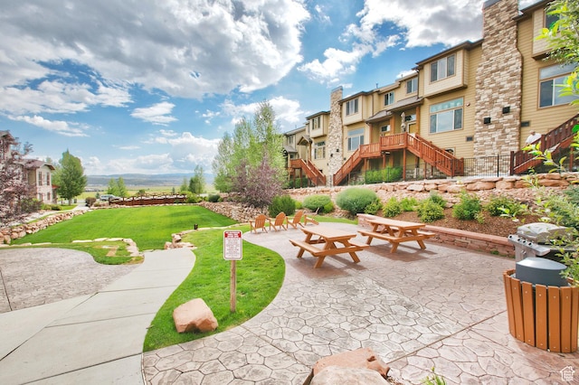 5519 N Lillehammer Ln Unit 1201, Park City, UT 84098 - view of community featuring stairway, a residential view, and a lawn