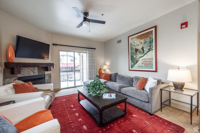 5519 N Lillehammer Ln Unit 1201, Park City, UT 84098 - carpeted living area with a stone fireplace, visible vents, and ceiling fan
