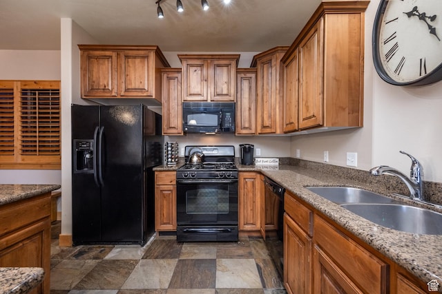 5519 N Lillehammer Ln Unit 1201, Park City, UT 84098 - kitchen featuring a sink, brown cabinets, dark stone countertops, black appliances, and stone finish floor