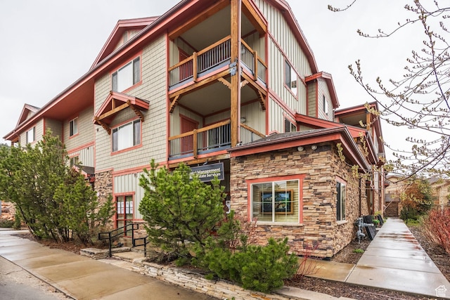 5519 N Lillehammer Ln Unit 1201, Park City, UT 84098 - exterior space featuring board and batten siding, a balcony, and stone siding
