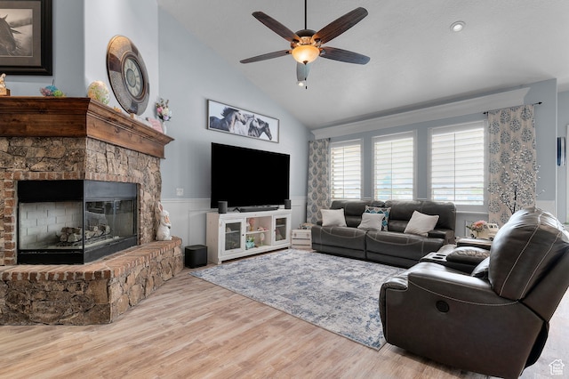 2277 W 900 N, Lehi, UT 84043 - living room with wood finished floors, a wainscoted wall, a fireplace, high vaulted ceiling, and a ceiling fan