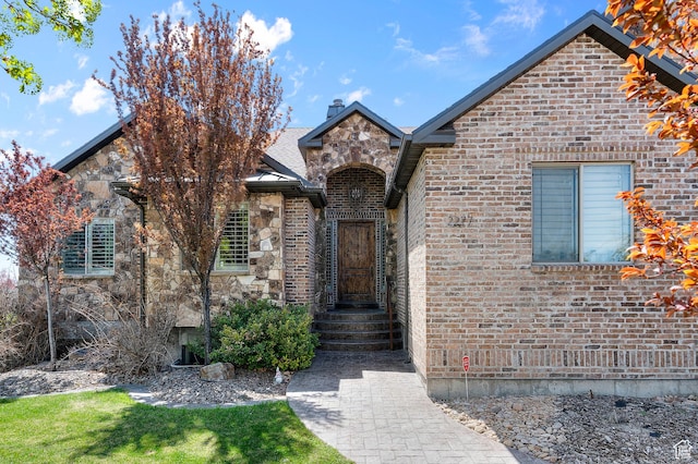 2277 W 900 N, Lehi, UT 84043 - view of front of house featuring a chimney, brick siding, and stone siding