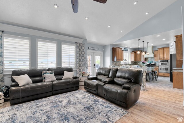 2277 W 900 N, Lehi, UT 84043 - living room with recessed lighting, light wood finished floors, ceiling fan, lofted ceiling, and french doors