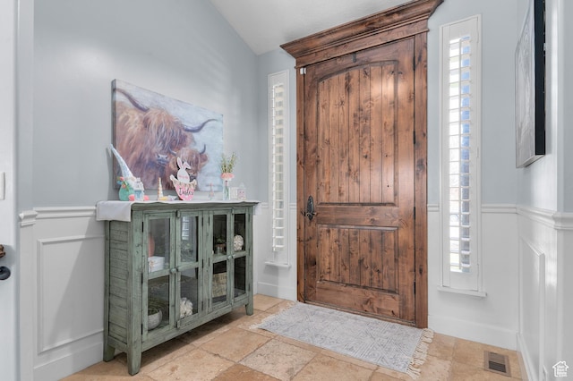 2277 W 900 N, Lehi, UT 84043 - foyer entrance featuring visible vents, a wainscoted wall, and lofted ceiling