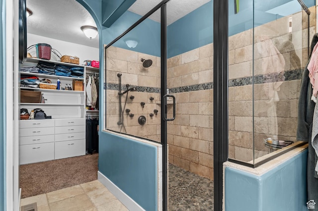 2277 W 900 N, Lehi, UT 84043 - full bathroom with a stall shower, a walk in closet, and visible vents