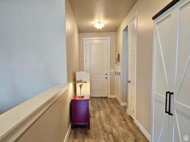 1013 W 90 S, Spanish Fork, UT 84660 - corridor with wood finished floors, baseboards, and a textured ceiling