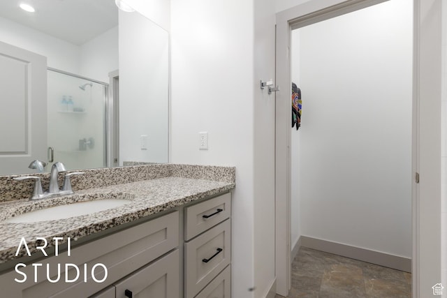 442 E Depot St Unit 107, Clearfield, UT 84015 - full bath with baseboards, a stall shower, stone finish floor, and vanity