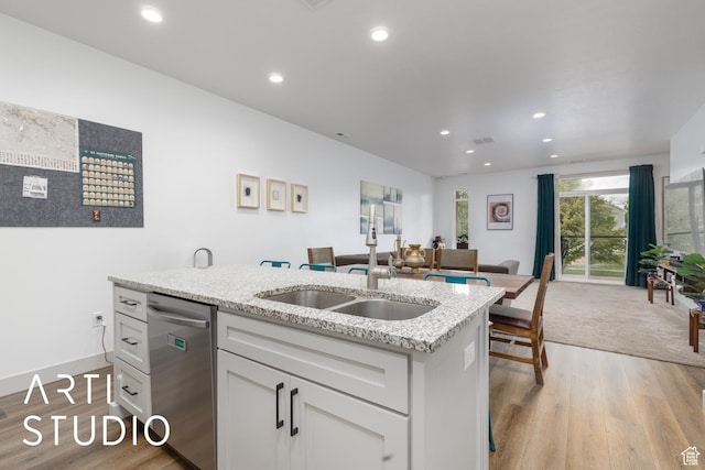 442 E Depot St Unit 107, Clearfield, UT 84015 - kitchen with stainless steel dishwasher, light wood finished floors, a sink, and open floor plan