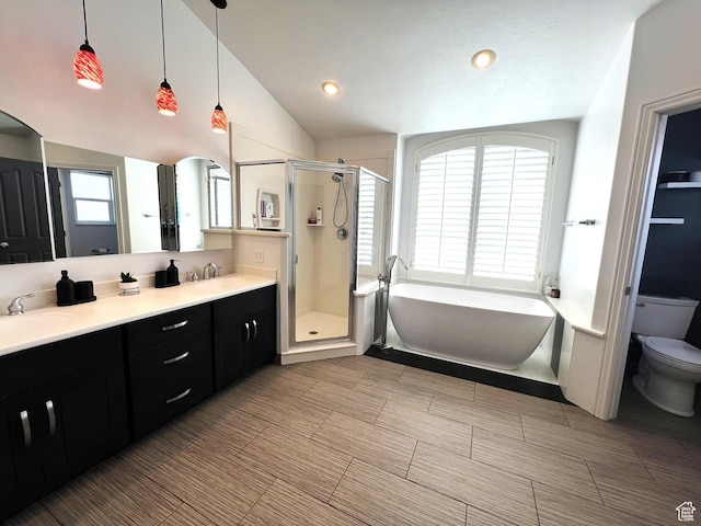1307 E Brandy Ln S, Tooele, UT 84074 - bathroom with a freestanding bath, a shower stall, double vanity, toilet, and a sink