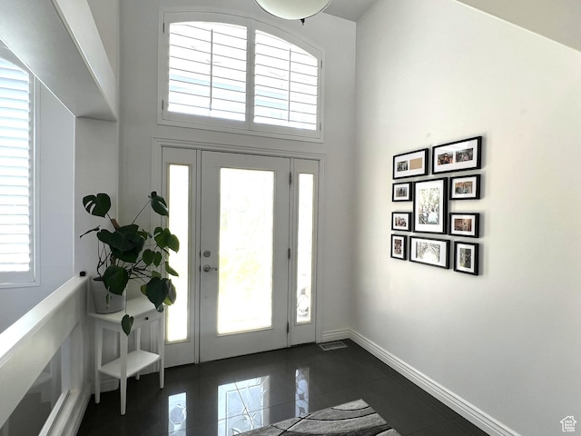 1307 E Brandy Ln S, Tooele, UT 84074 - entrance foyer featuring a high ceiling, baseboards, and a healthy amount of sunlight
