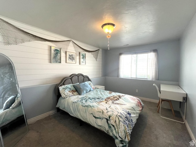 1307 E Brandy Ln S, Tooele, UT 84074 - bedroom with wooden walls, carpet, and baseboards