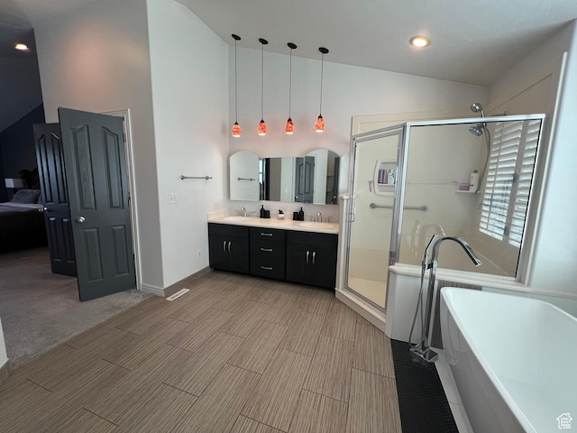 1307 E Brandy Ln S, Tooele, UT 84074 - bathroom with double vanity, a freestanding bath, a stall shower, and a sink
