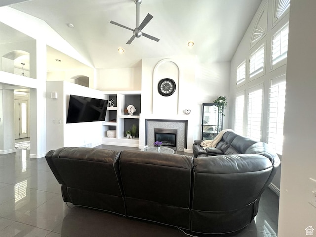 1307 E Brandy Ln S, Tooele, UT 84074 - living area featuring a fireplace, high vaulted ceiling, tile patterned floors, a ceiling fan, and baseboards
