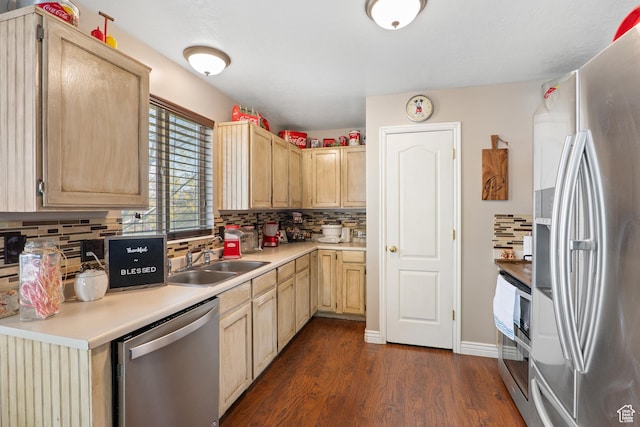 5036 W Cedar Point Peak Dr, Riverton, UT 84096 - kitchen with decorative backsplash, a sink, light brown cabinets, stainless steel appliances, and dark wood-type flooring