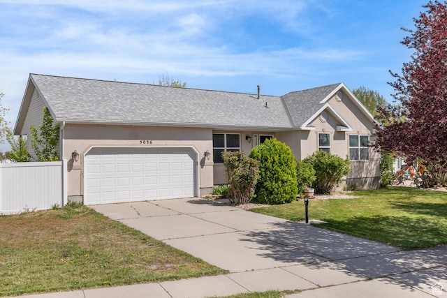 5036 W Cedar Point Peak Dr, Riverton, UT 84096 - single story home with a front lawn, a garage, concrete driveway, stucco siding, and fence