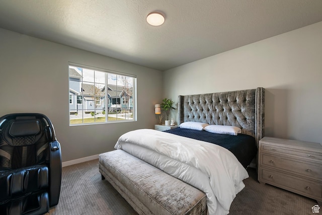 bedroom with carpet floors and baseboards