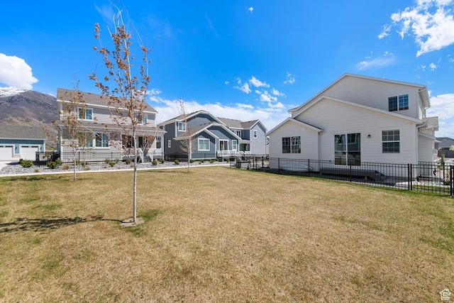 exterior space with a lawn and fence