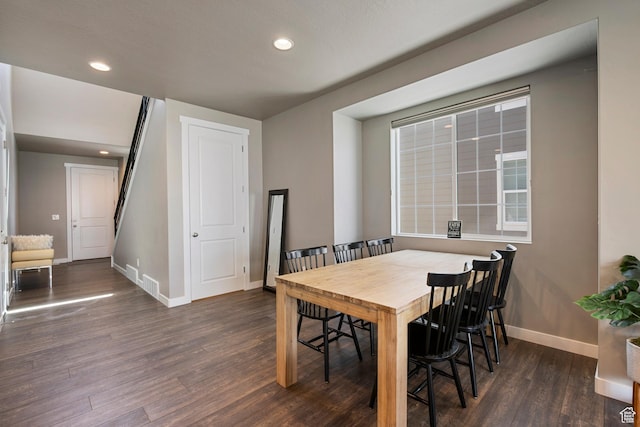 dining room featuring baseboards, recessed lighting, and wood finished floors
