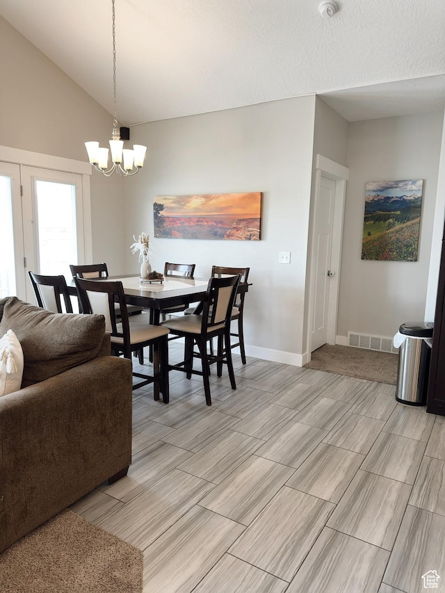 2743 W Lacewood Dr S, Taylorsville, UT 84129 - dining room with a chandelier, vaulted ceiling, baseboards, visible vents, and wood tiled floor